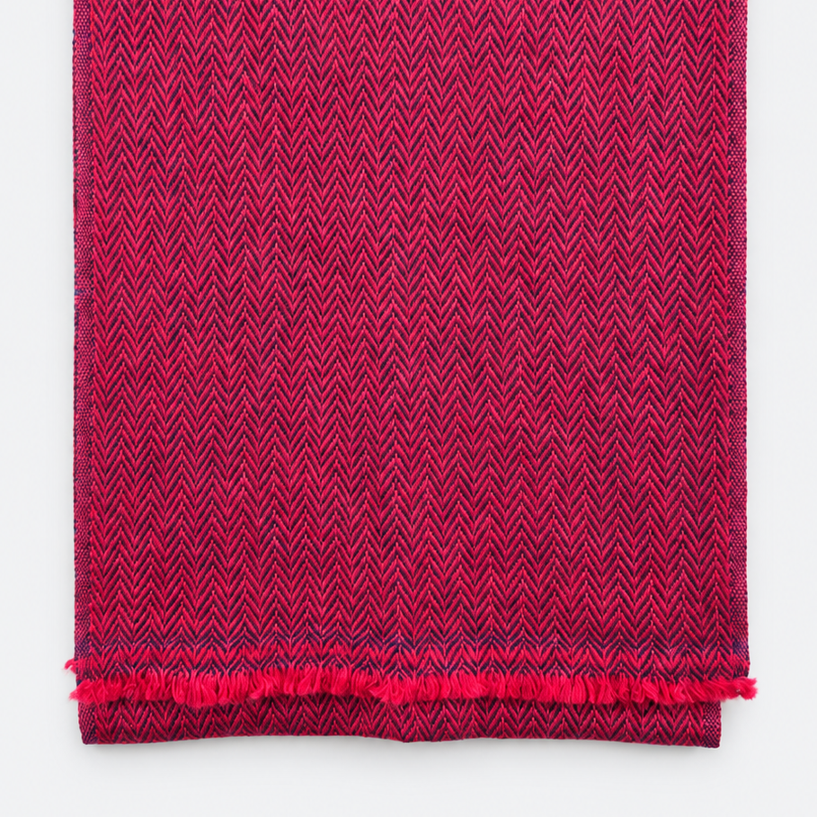 Folded magenta and navy herringbone scarf with fringe