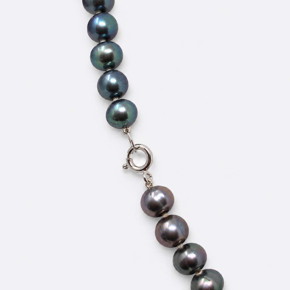 Dark iridescent pearls and clasp detail