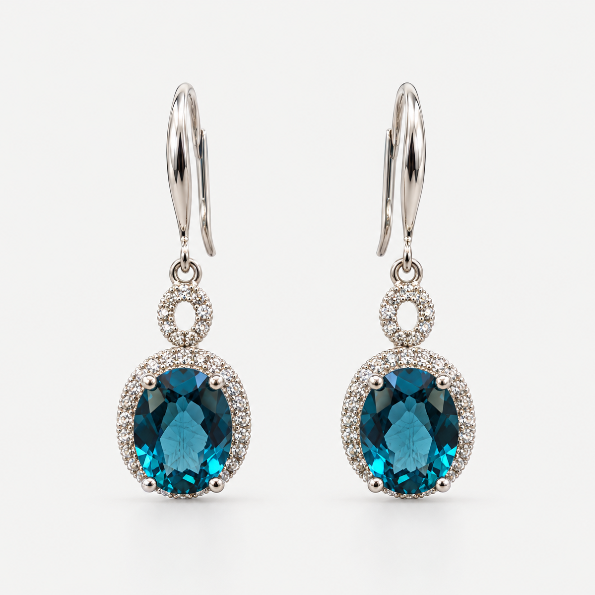 London Blue Topaz Drop Earrings in sterling silver on a neutral background
