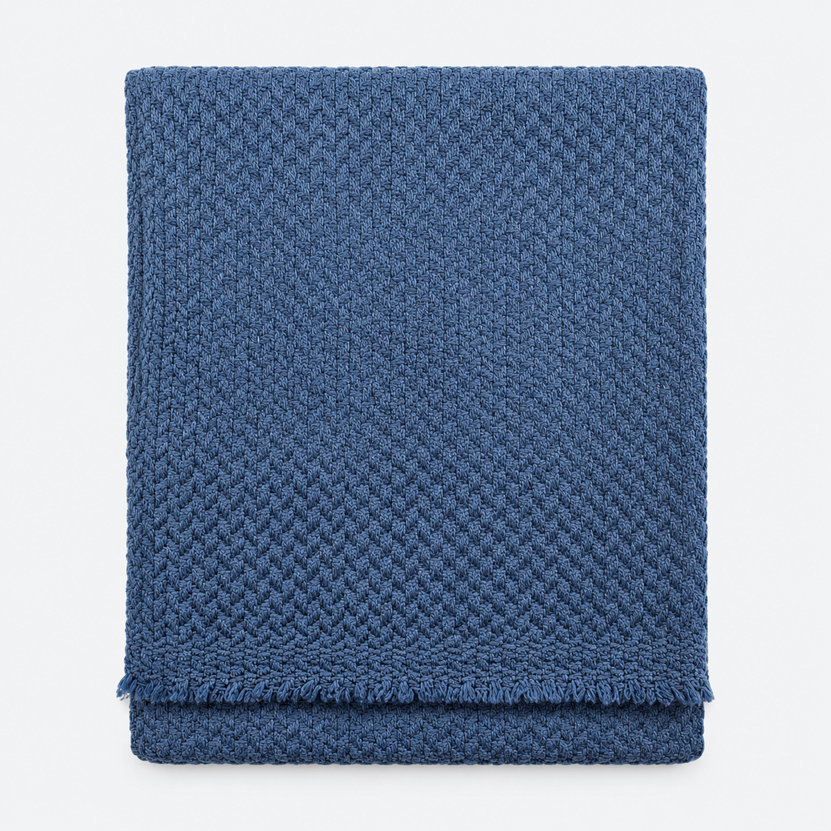 Folded slate blue textured scarf with fringed edges
