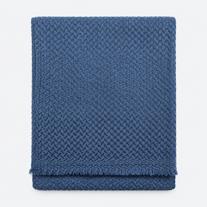 Folded slate blue textured scarf with fringed edges