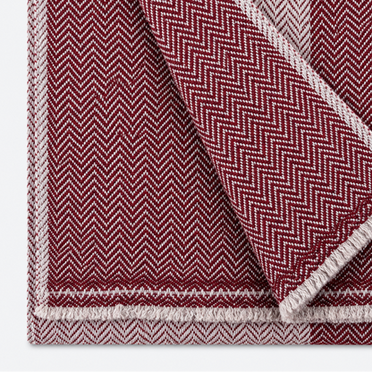 Burgundy and ivory herringbone scarf folded close-up