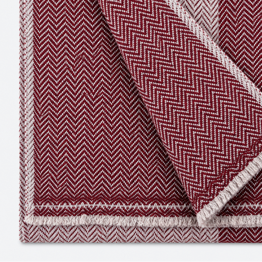 Burgundy and ivory herringbone scarf folded close-up
