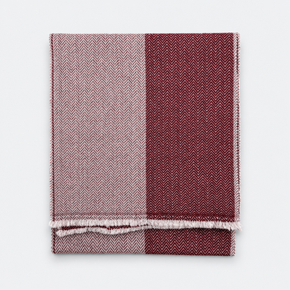 Two-tone burgundy and ivory scarf folded flat