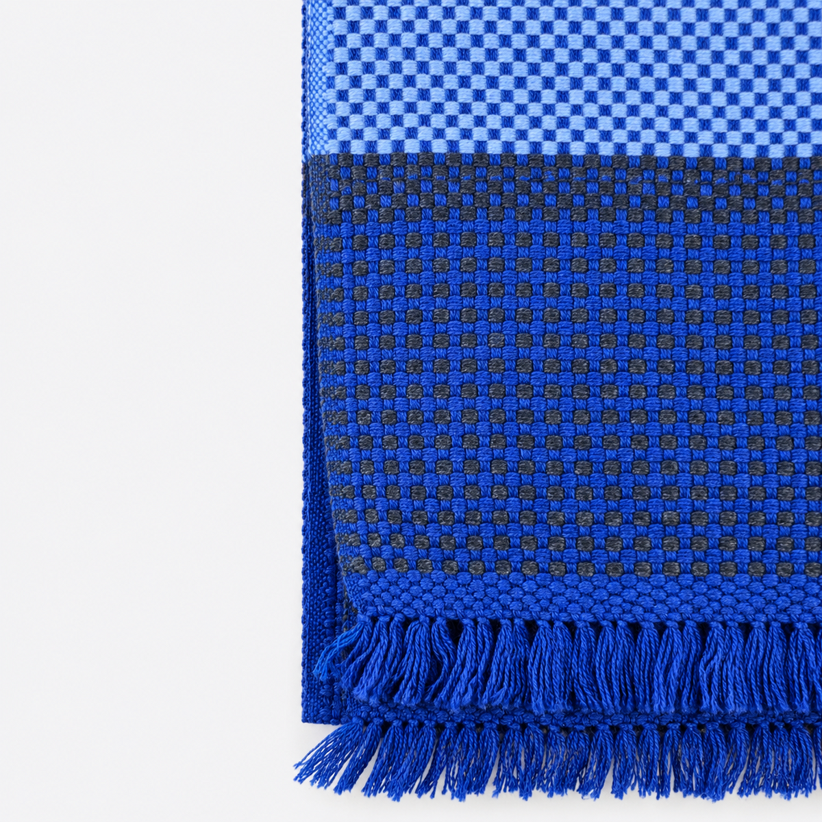 Cobalt blue woven pattern and fringe detail