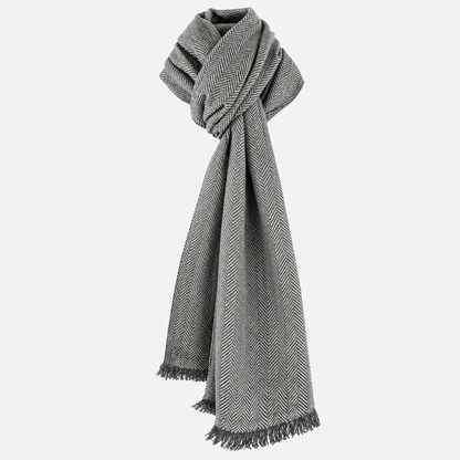 Gray herringbone scarf tied in an elegant knot