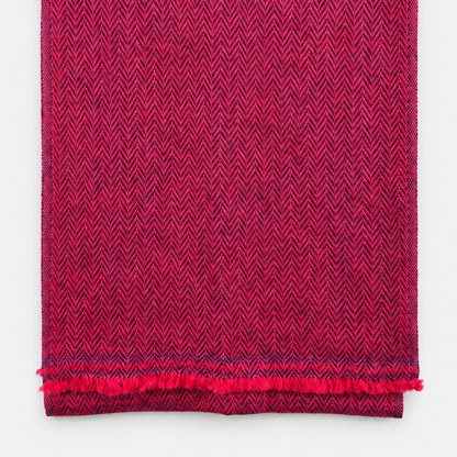 Folded magenta and navy herringbone scarf with fringe