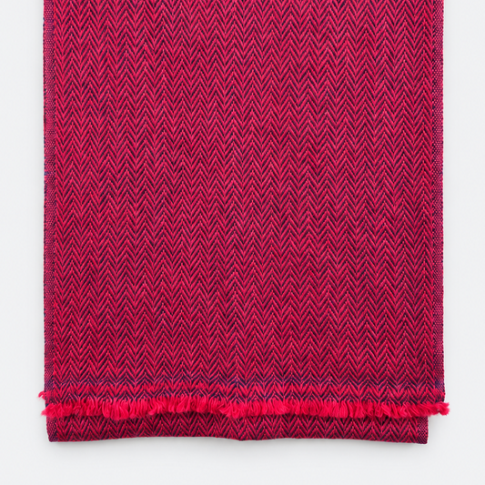 Folded magenta and navy herringbone scarf with fringe