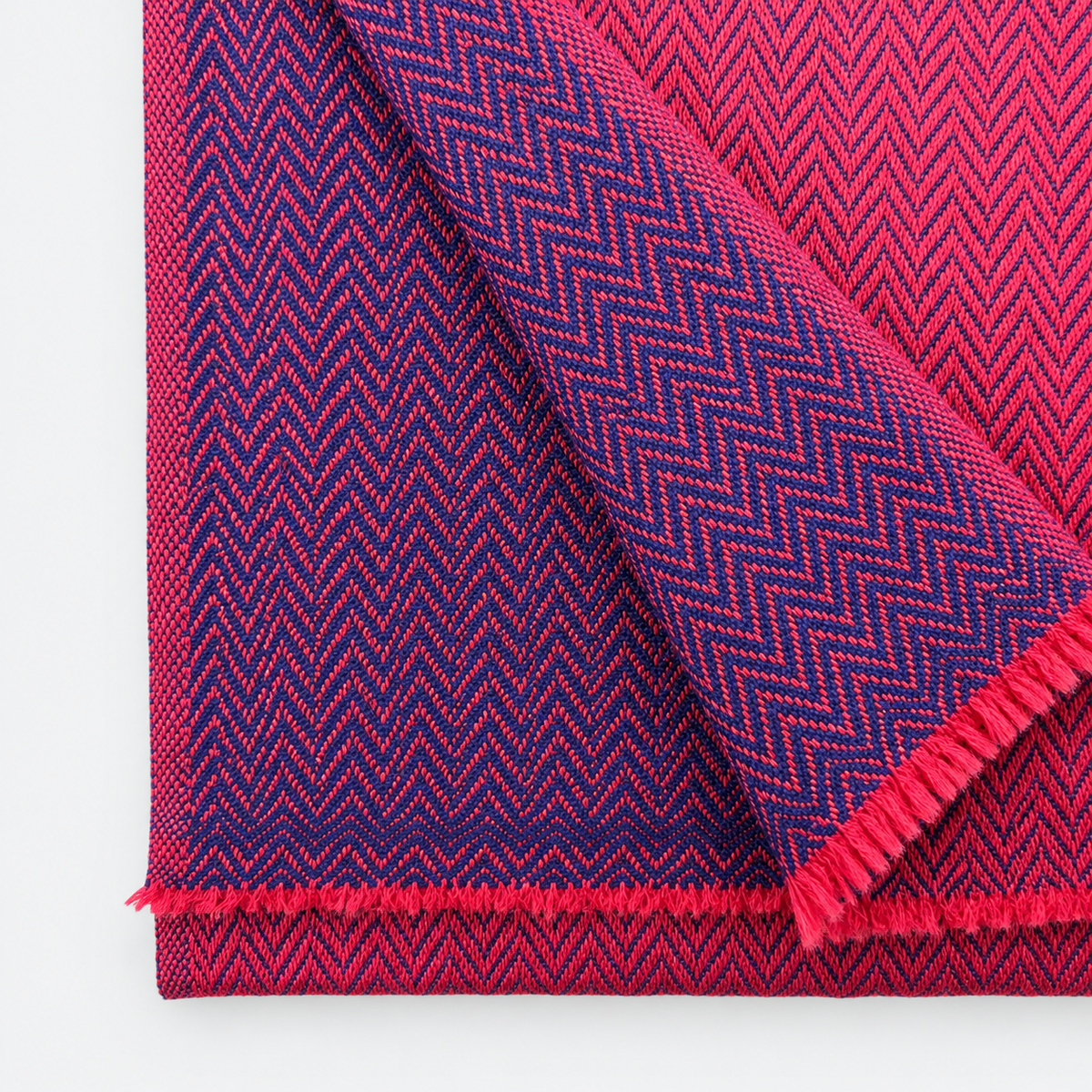 Magenta and navy herringbone woven pattern close-up