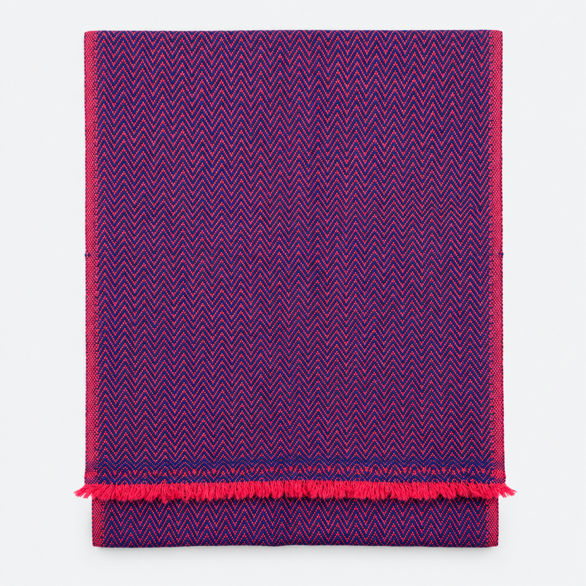 Folded navy and magenta herringbone scarf with fringe
