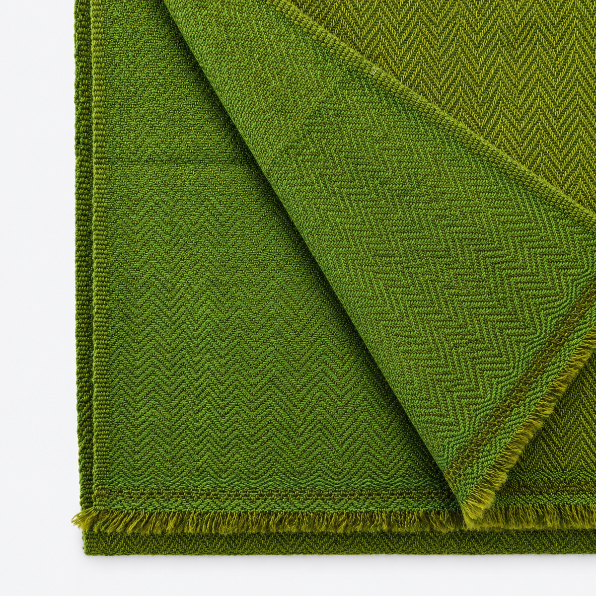 Close-up of olive herringbone woven textile