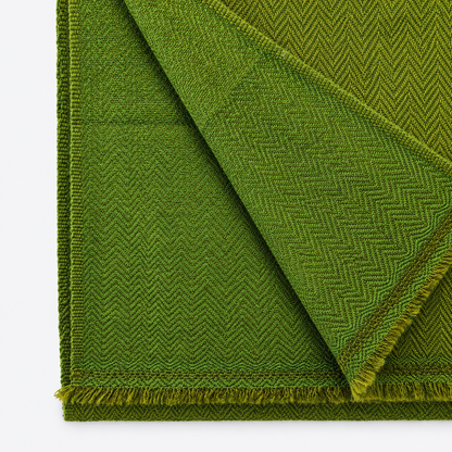 Close-up of olive herringbone woven textile