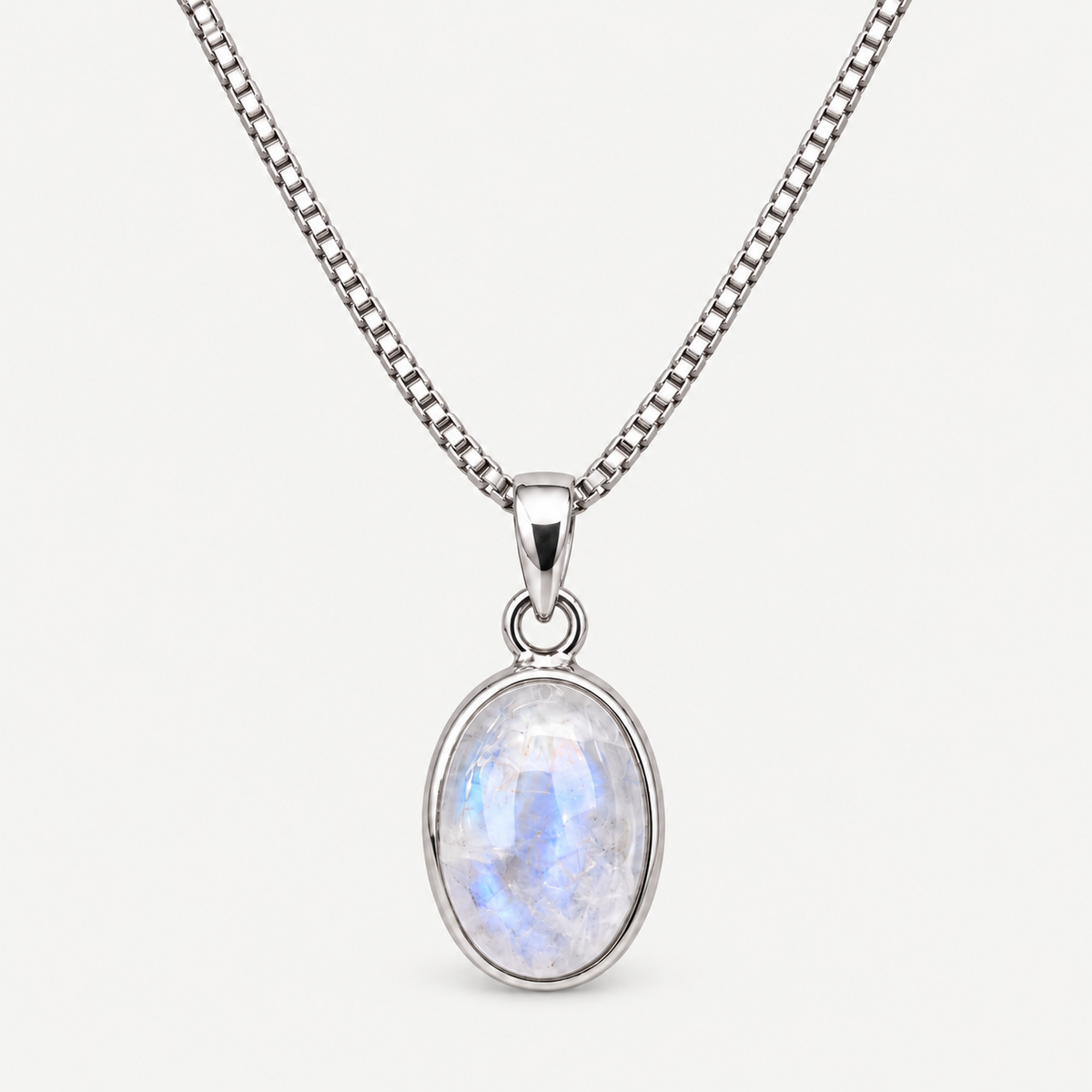 Oval moonstone pendant necklace close-up in polished sterling silver