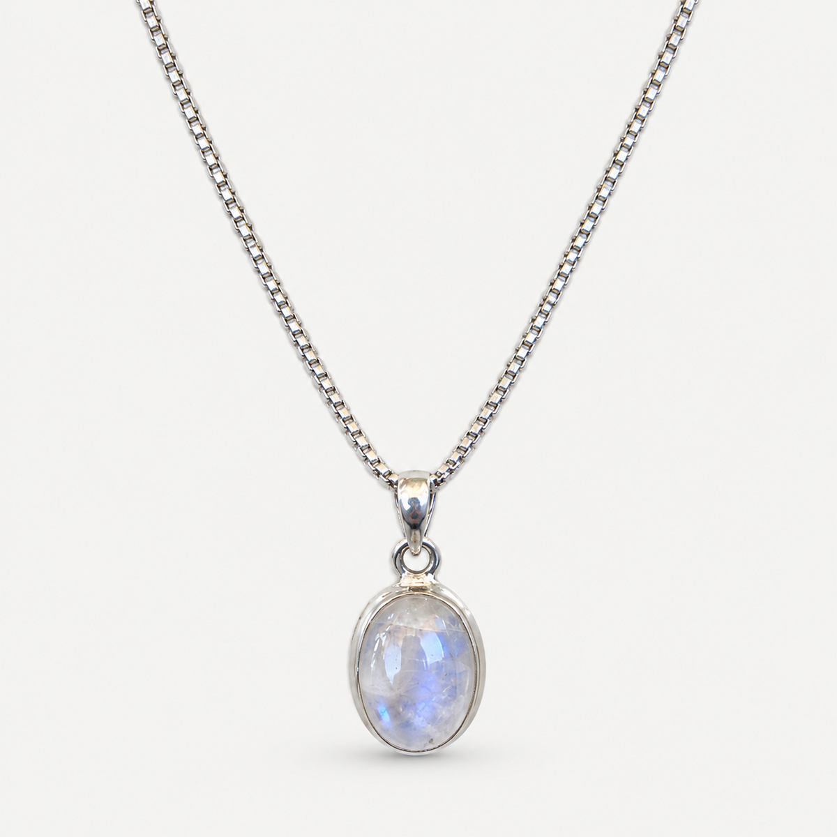 Oval moonstone bezel pendant with silver box chain