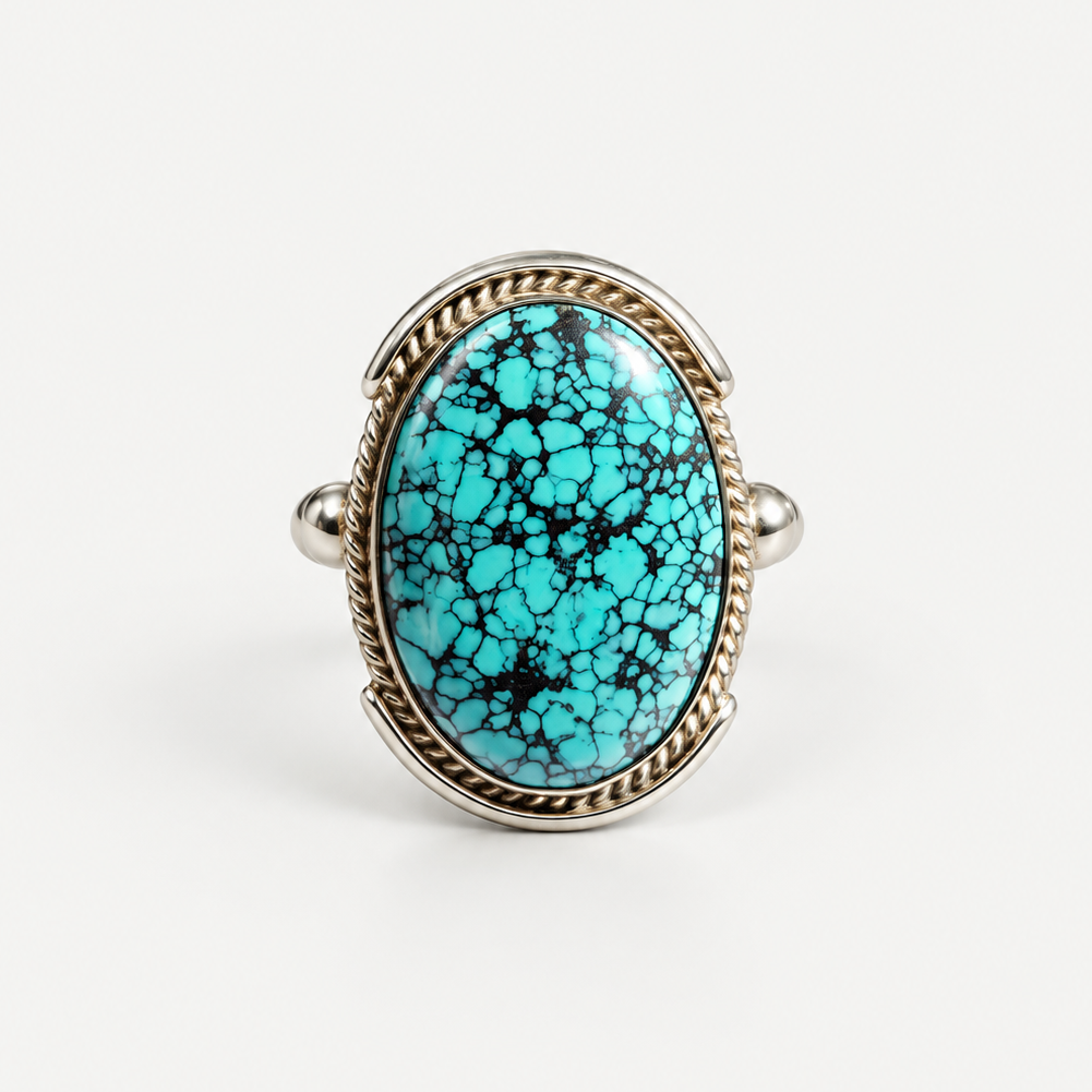 Spiderweb Turquoise Ring front view, oval turquoise cabochon in sterling silver
