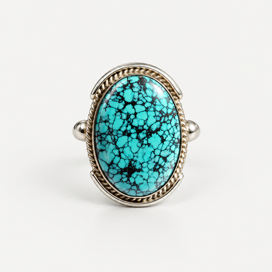 Spiderweb Turquoise Ring front view, oval turquoise cabochon in sterling silver